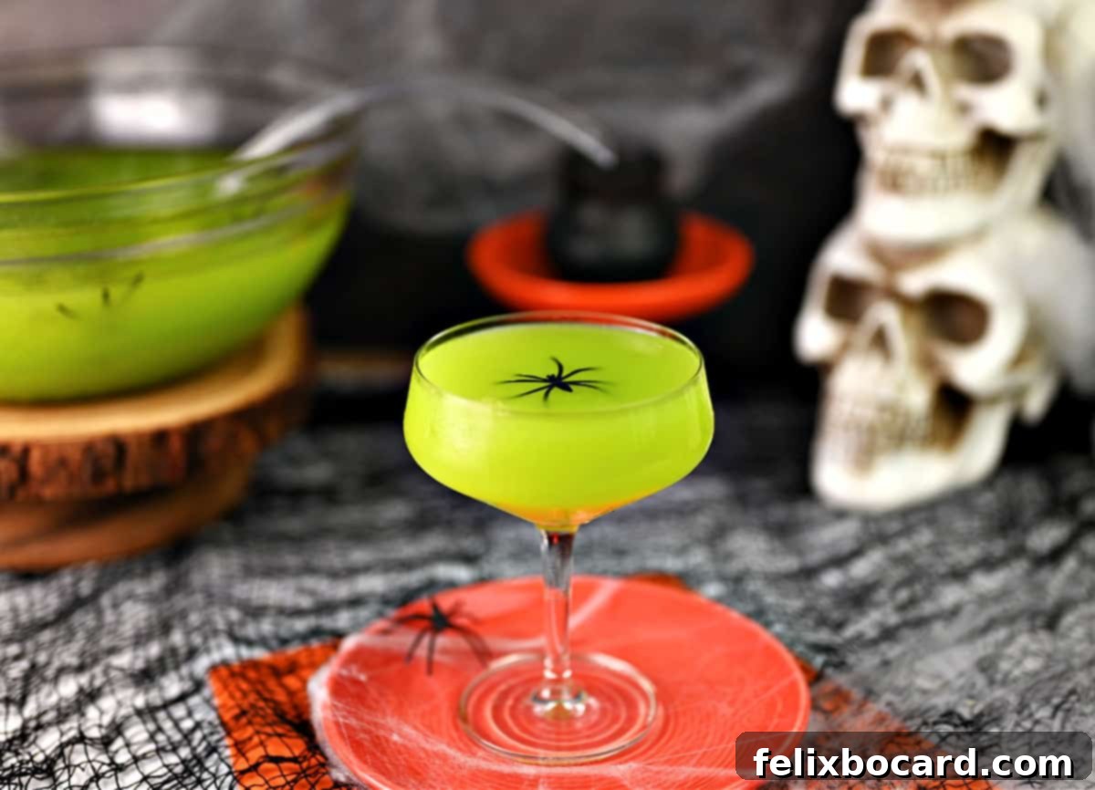 Monster Mash Punch 4 Witches brew in a coupe glass.