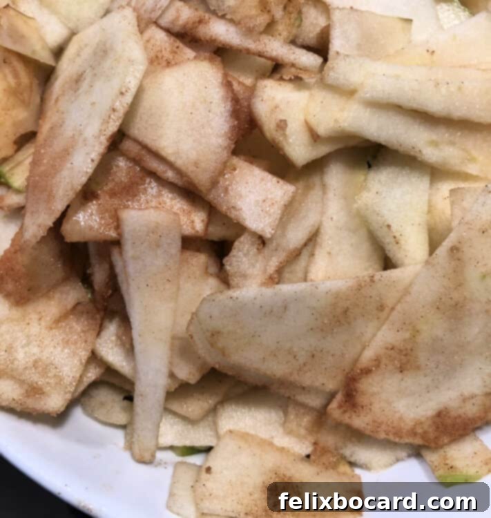 Sliced apples being prepared for apple crisp