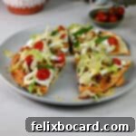 Air fried Mexican pizza cut up on a plate.