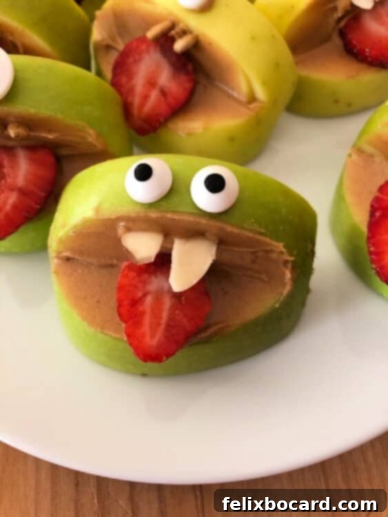 Silly apple bite on a white plate, showcasing a fun and easy snack idea for kids.