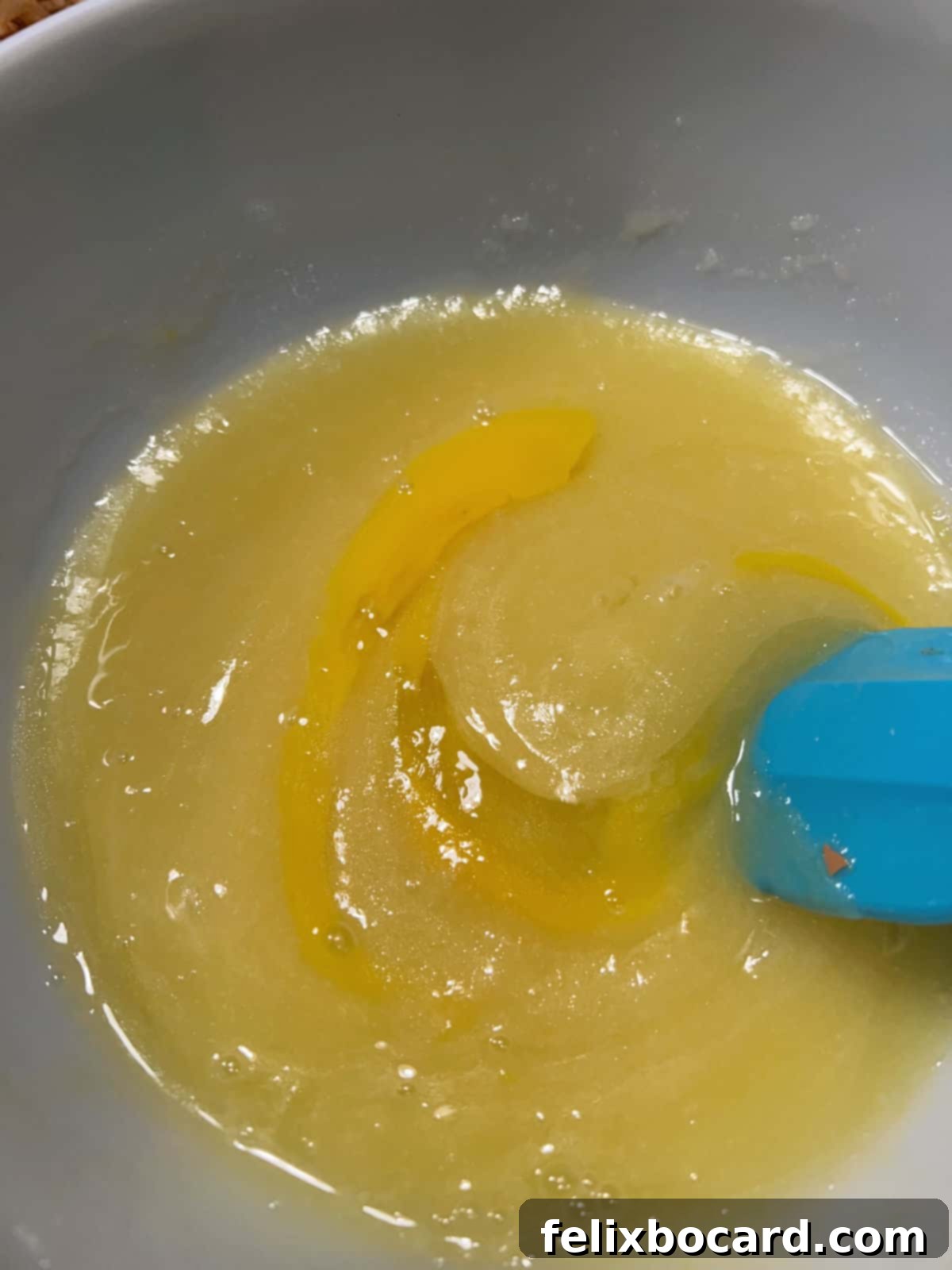 Eggs added to the bowl of batter.