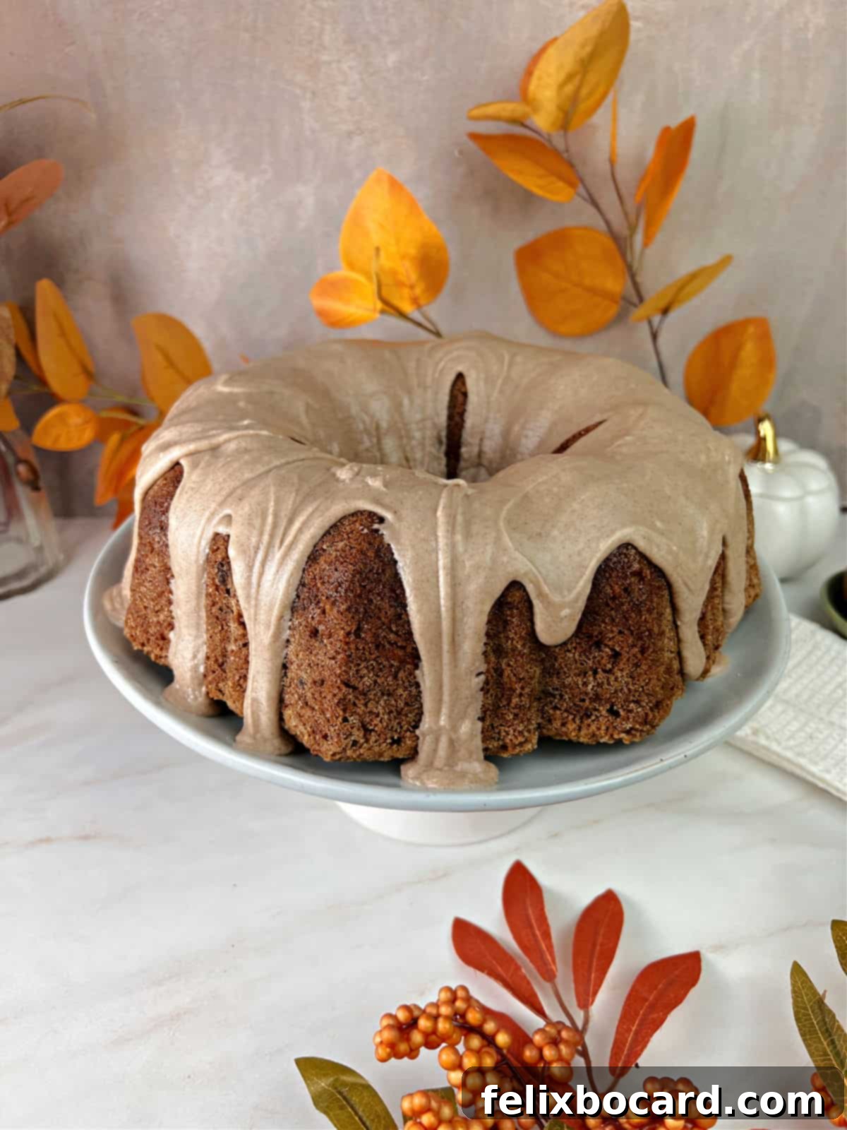 Old fashioned apple cake drizzled with a thick cinnamon glaze.