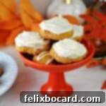 Small dish with a stack of old fashioned pumpkin cookies, frosted with cream cheese frosting and ready to eat!