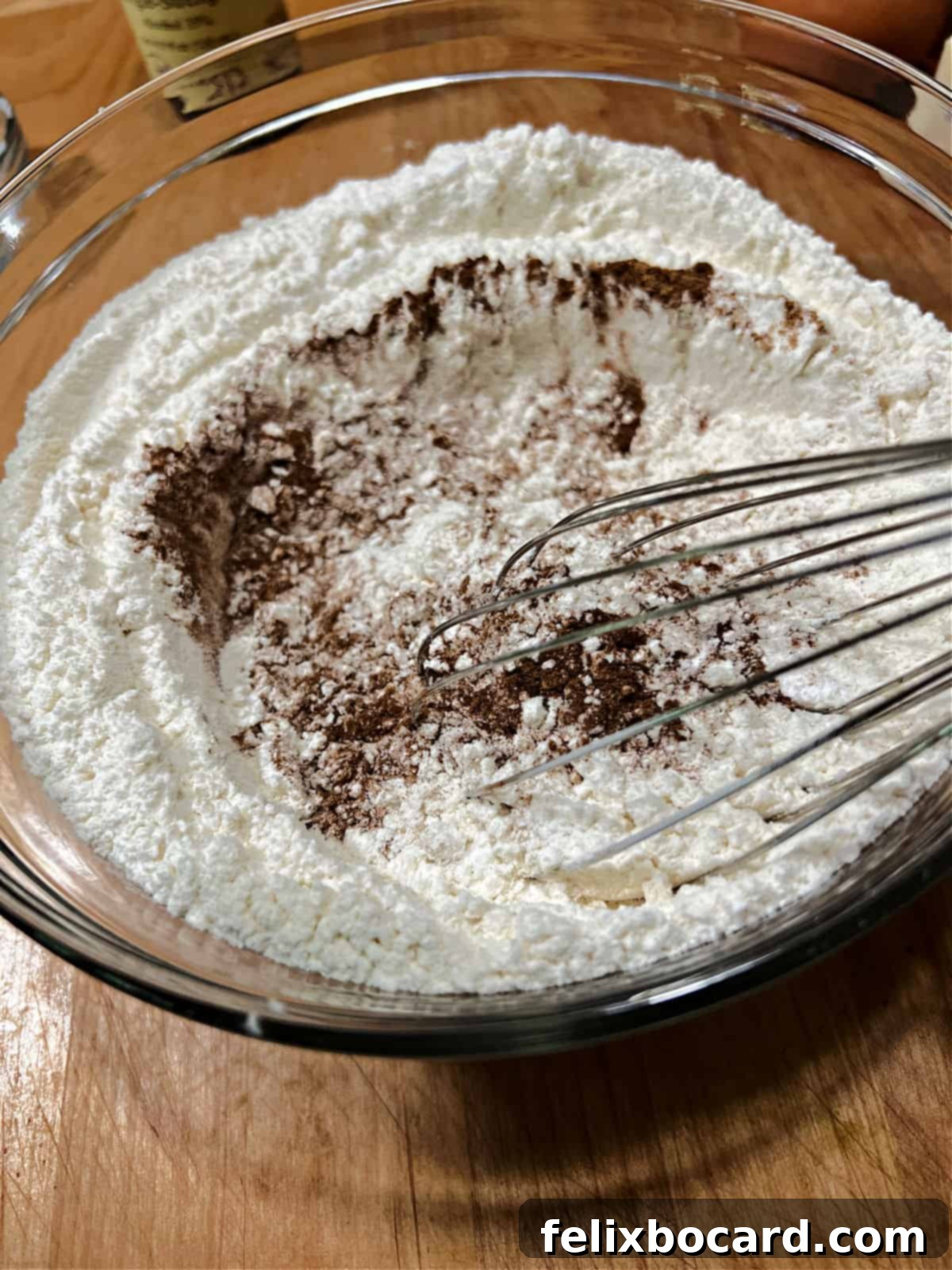 Whisking spices into the flour.