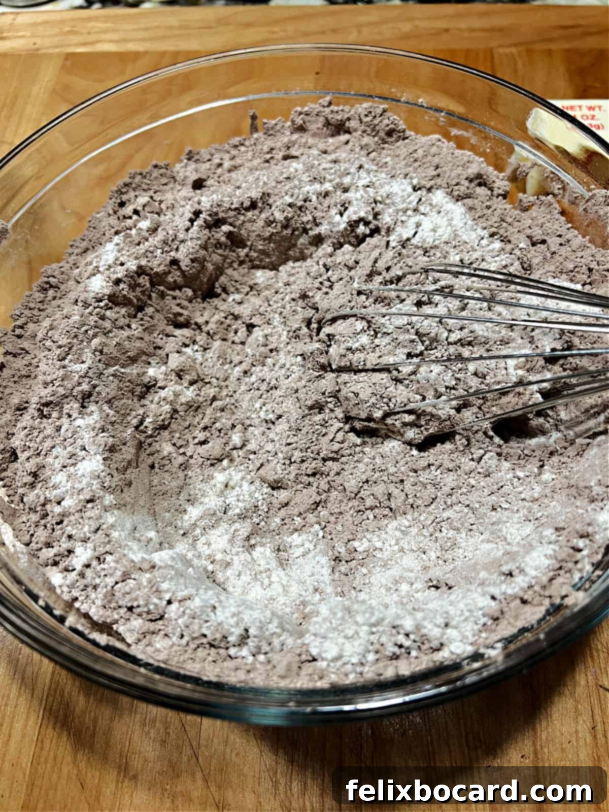 adding flour to the brownie mix.