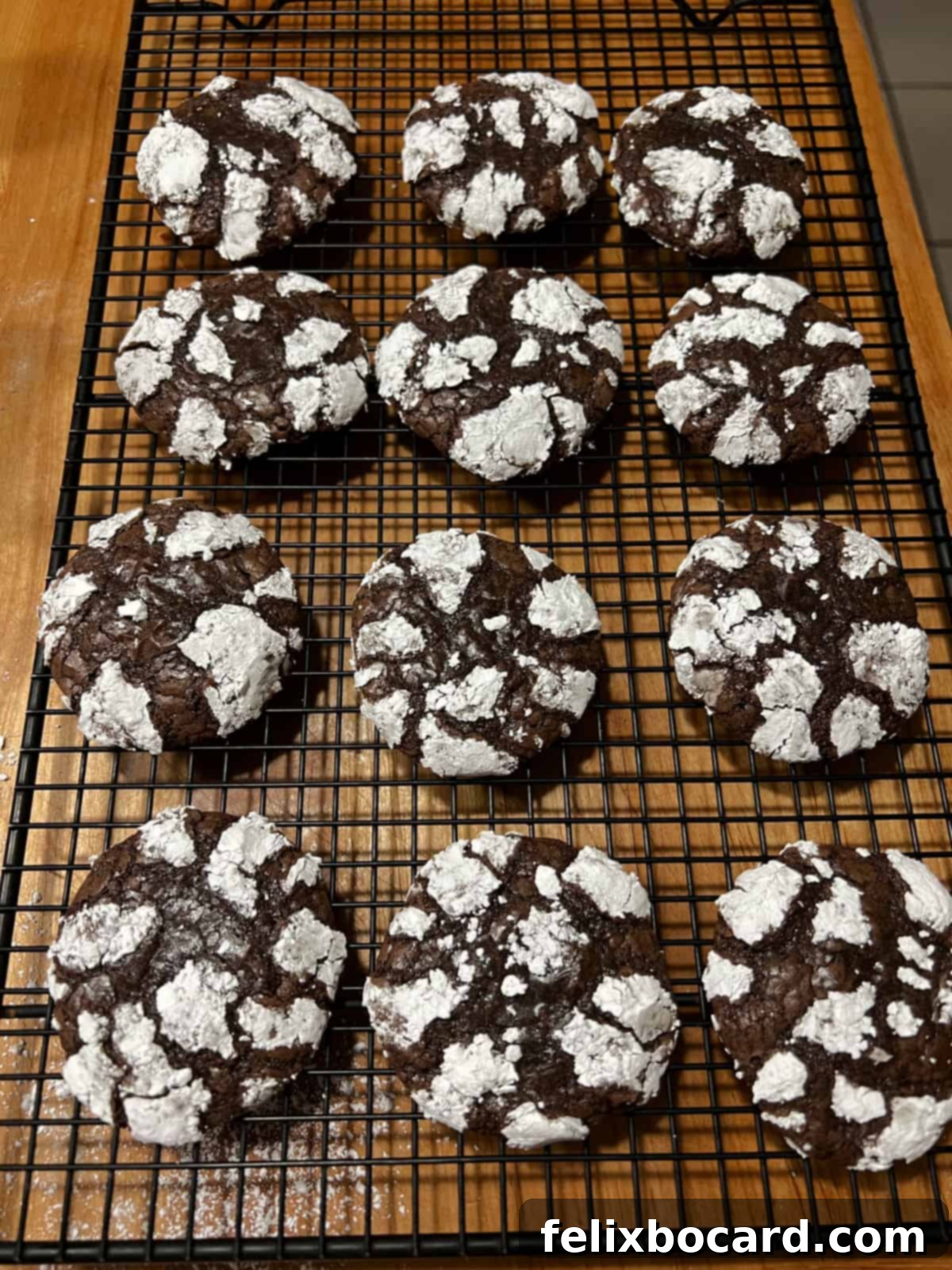 Brownie mix cookies cooling on a wire rack.