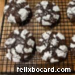 Brownie mix crinkle cookies cooling on a wire rack.