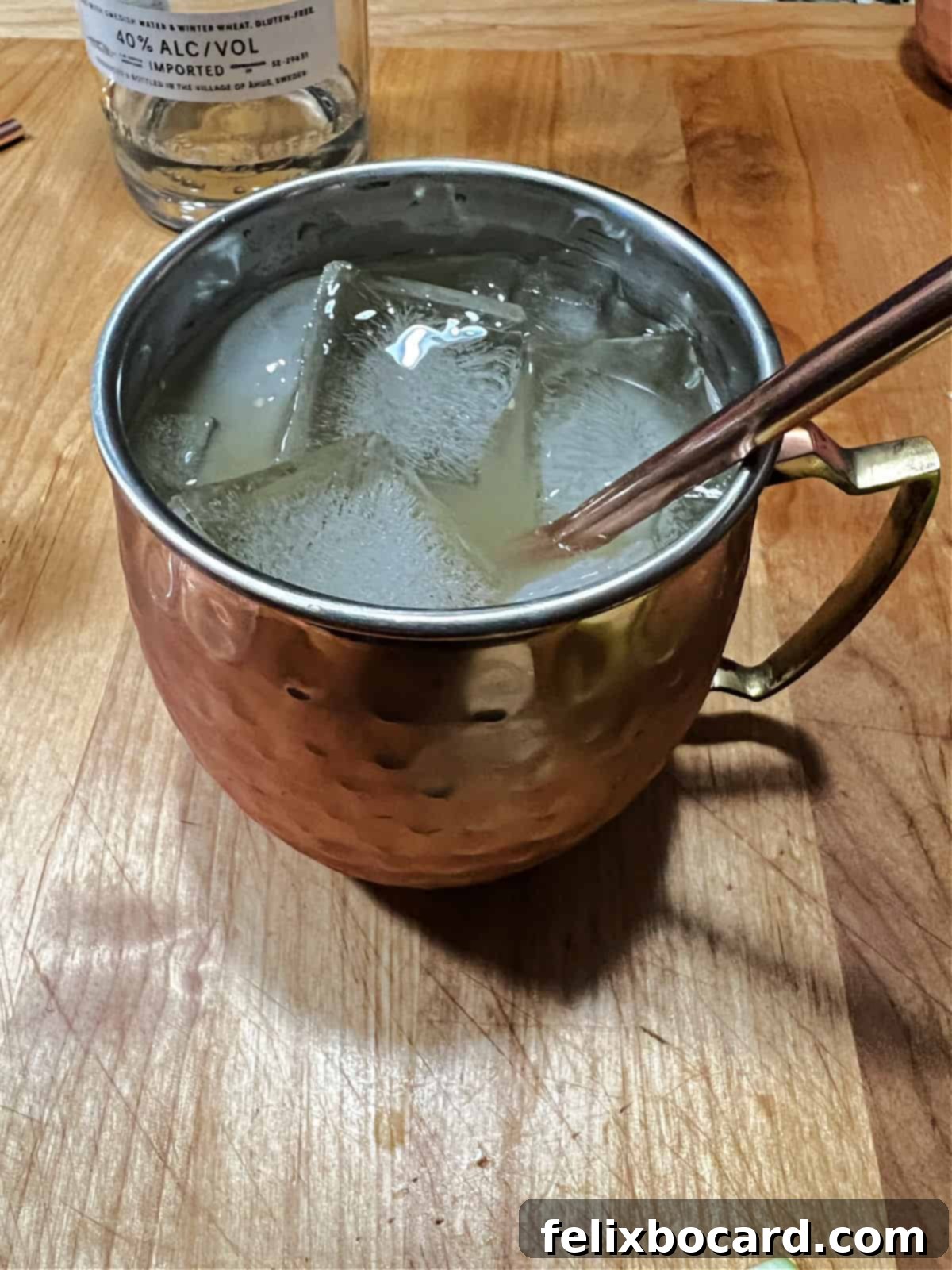 Spiced Apple Moscow Mule 5 Copper mug filled with ice and the Apple Cider Moscow Mule drink.