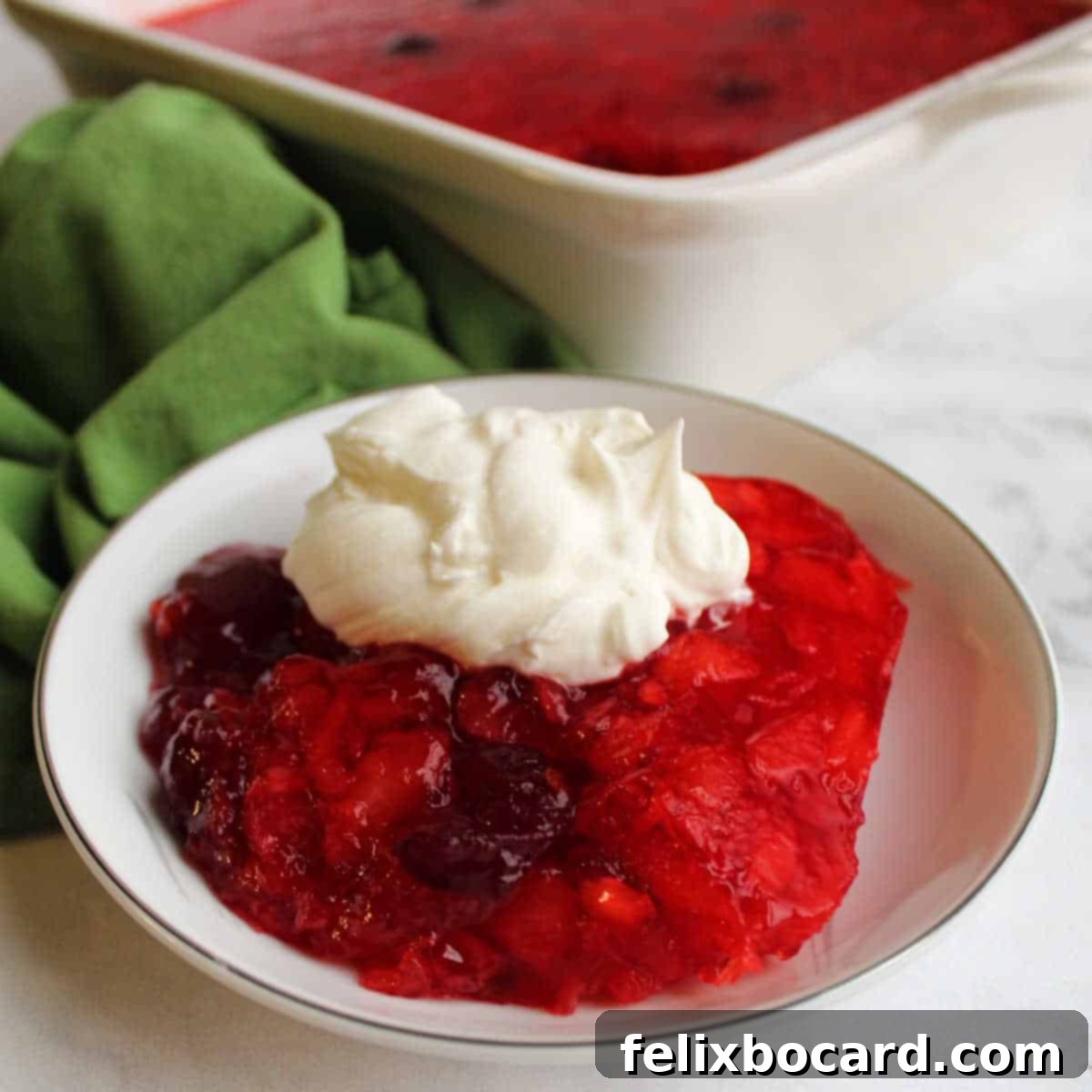 Serving of Thanksgiving classic Cranberry Jello Salad with pineapple.