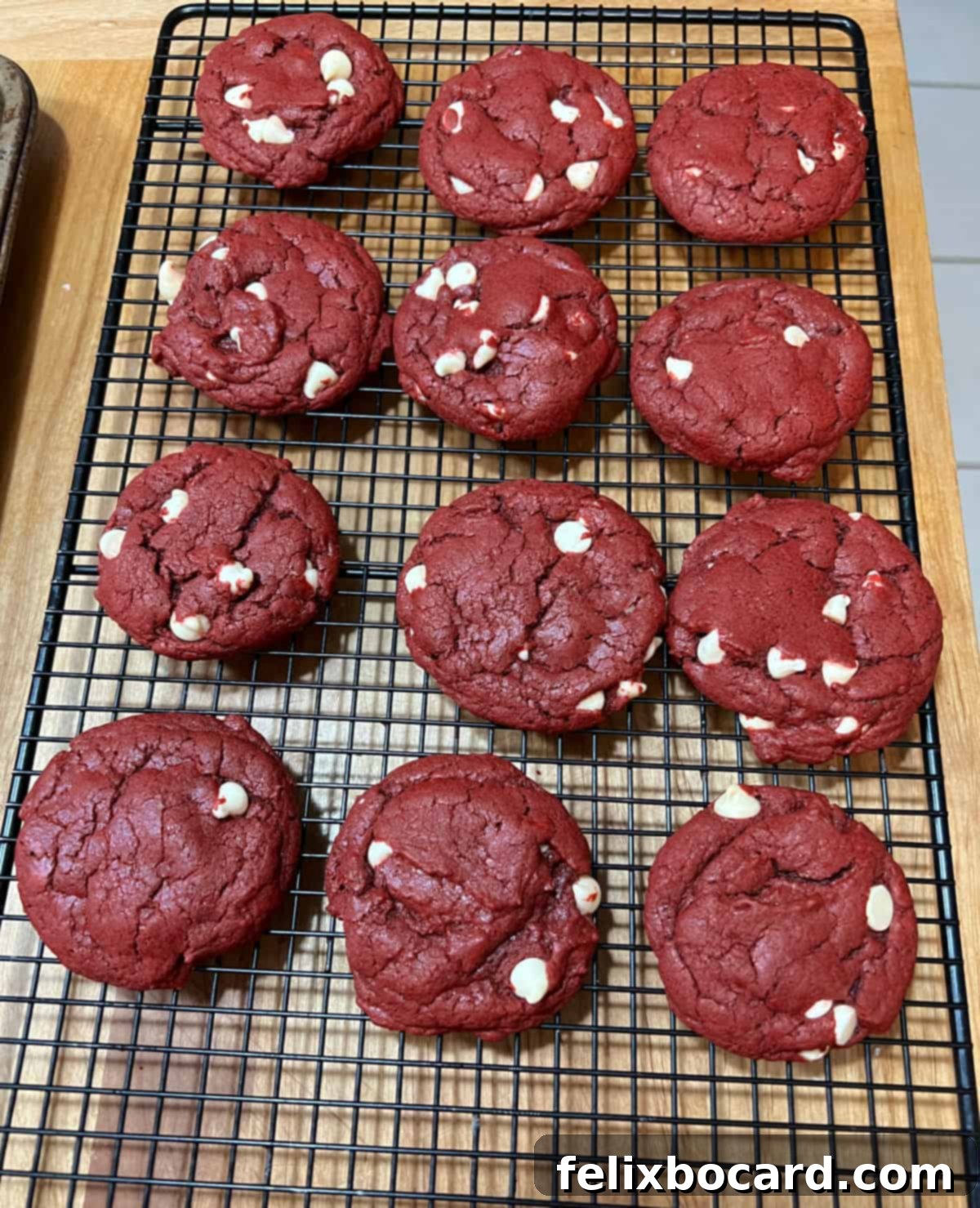 Red velvet cake mix cookies cooling on a wire rack.