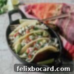 21 Delicious Makeovers for Your Leftover Shredded Chicken 24 Rotisserie Chicken Tacos with Slaw, a delightful culinary creation.