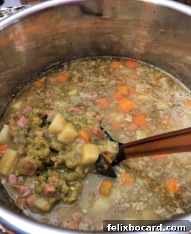 Rich and creamy Instant Pot Split Pea Soup after a good stir