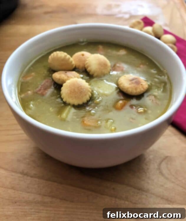 A warm, inviting bowl of Instant Pot Split Pea Soup with a spoon