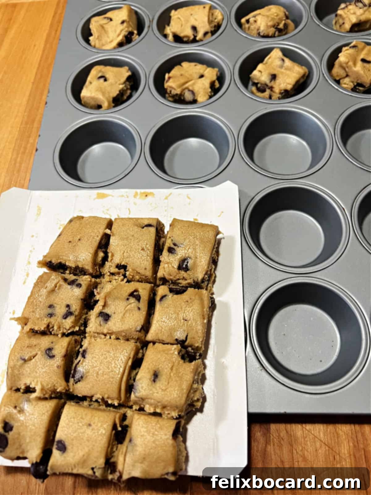 Placing individual squares of chocolate chip cookie dough into the mini muffin pan cups.
