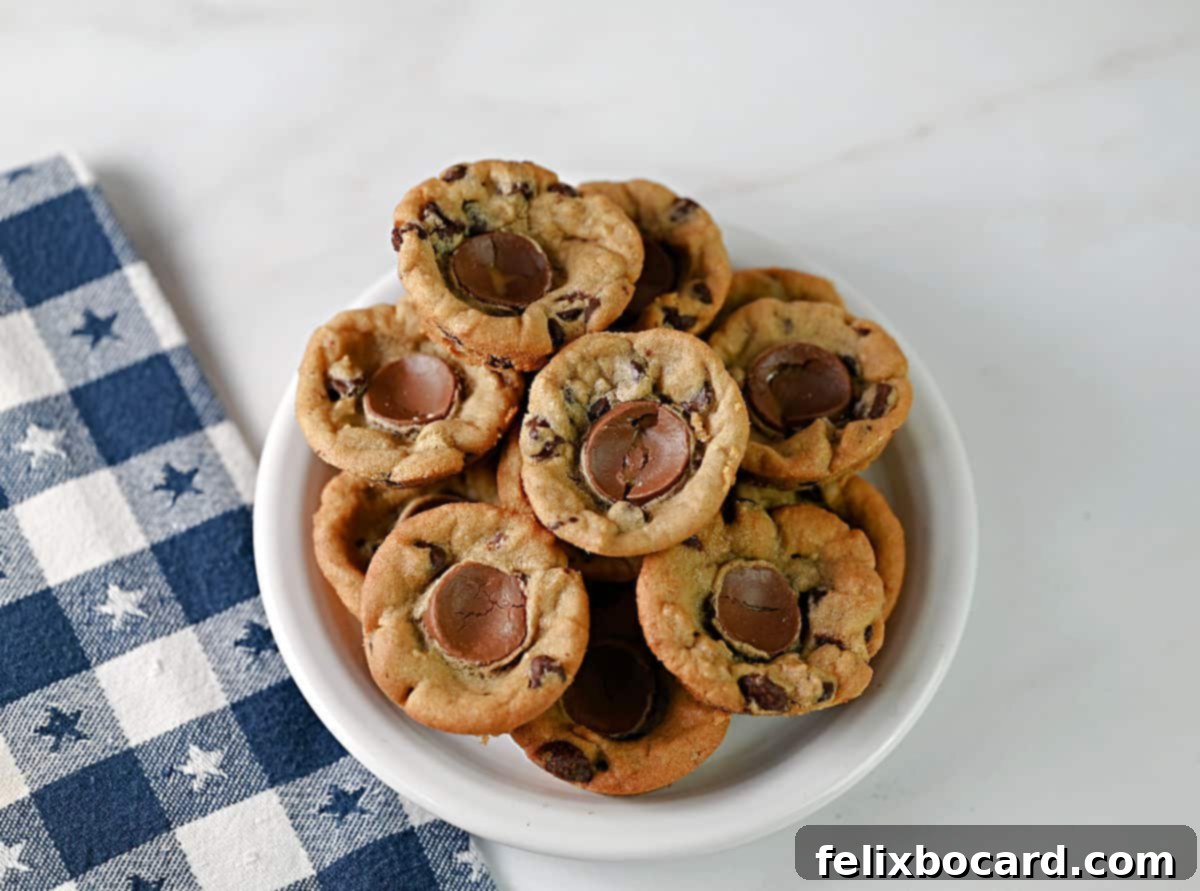 A small white plate with several Rolo stuffed chocolate chip cookie cups, ready for serving.
