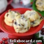 A small plate of glazed cranberry-orange meltaway cookies.