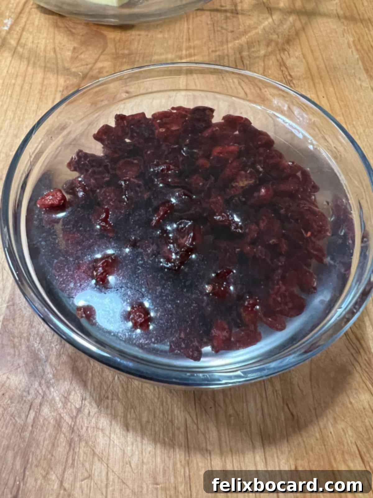 Dried cranberries soaking in water.