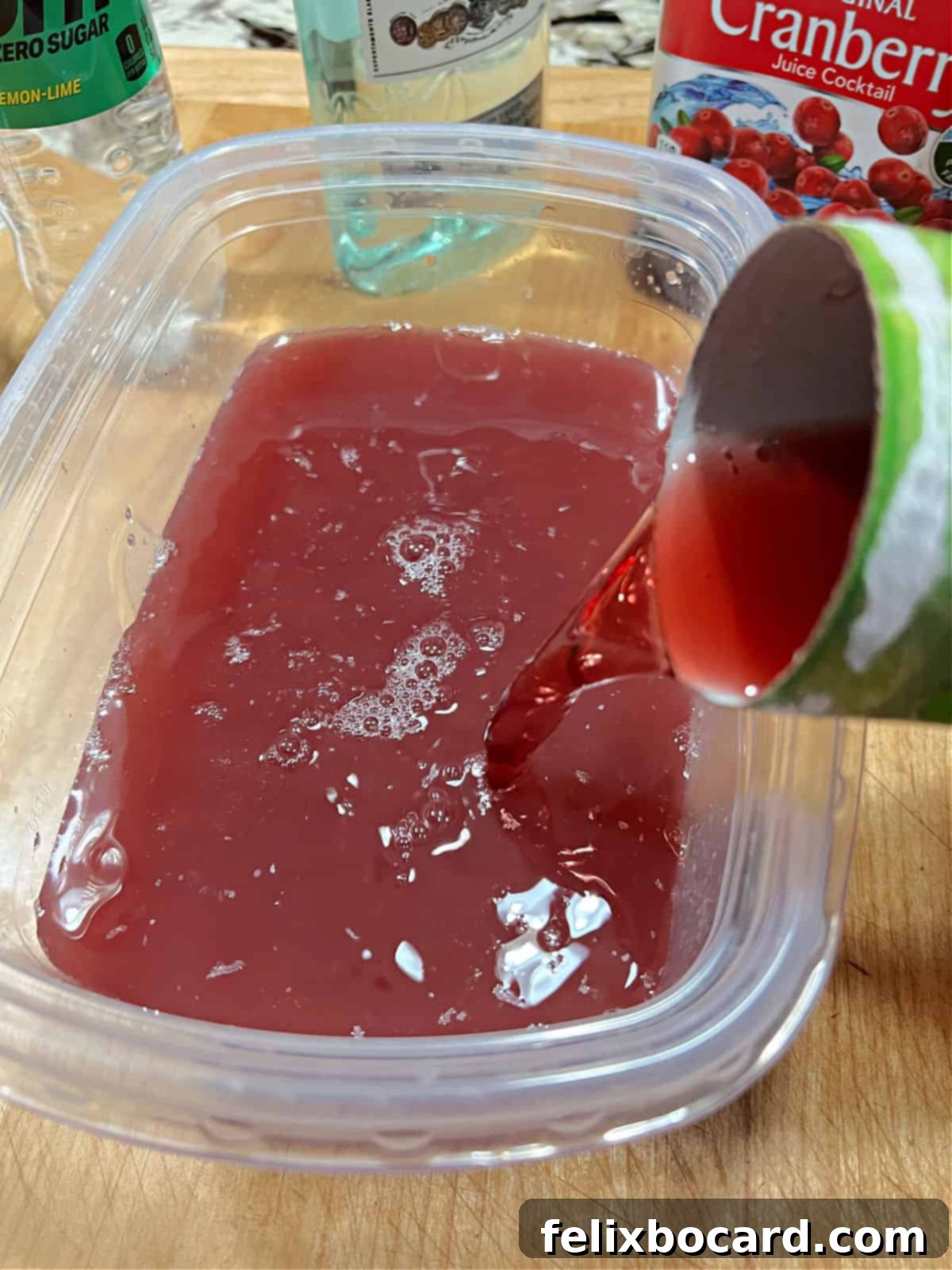 Pouring the ingredients into a freezer safe plastic container.