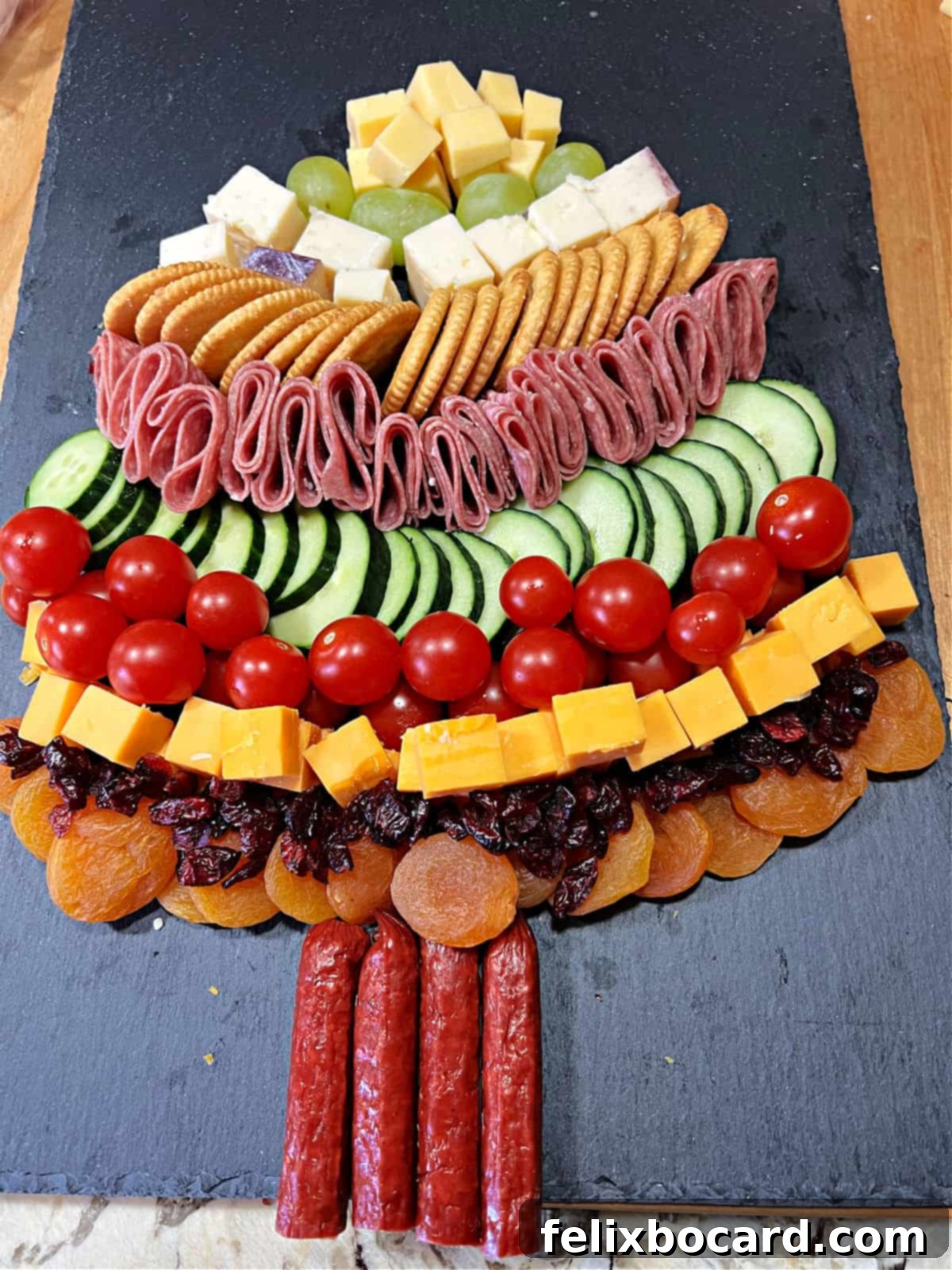 Dried fruits and sausage sticks added to the bottom of the tree.