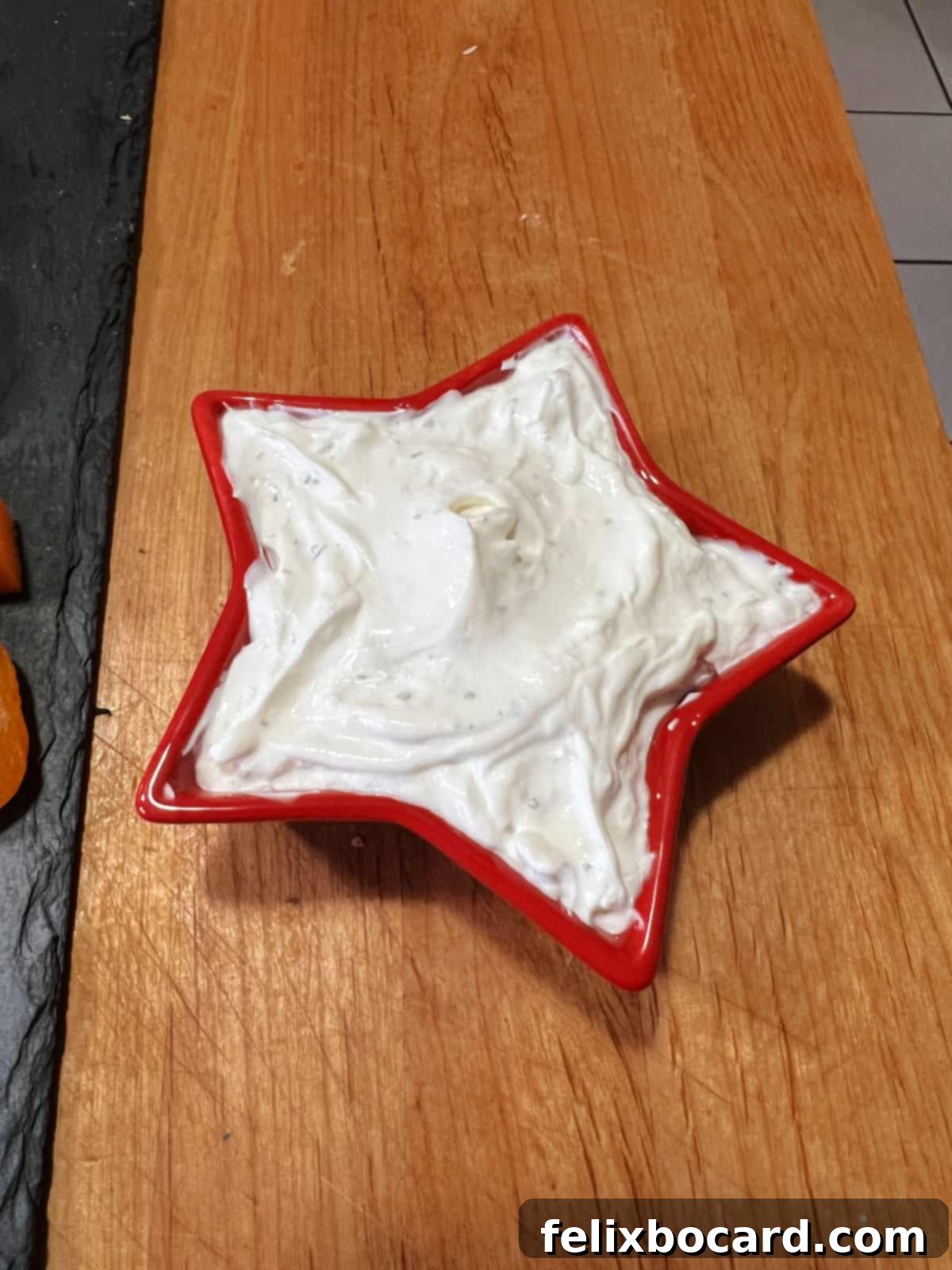 Star shaped bowl full of veggie dip.