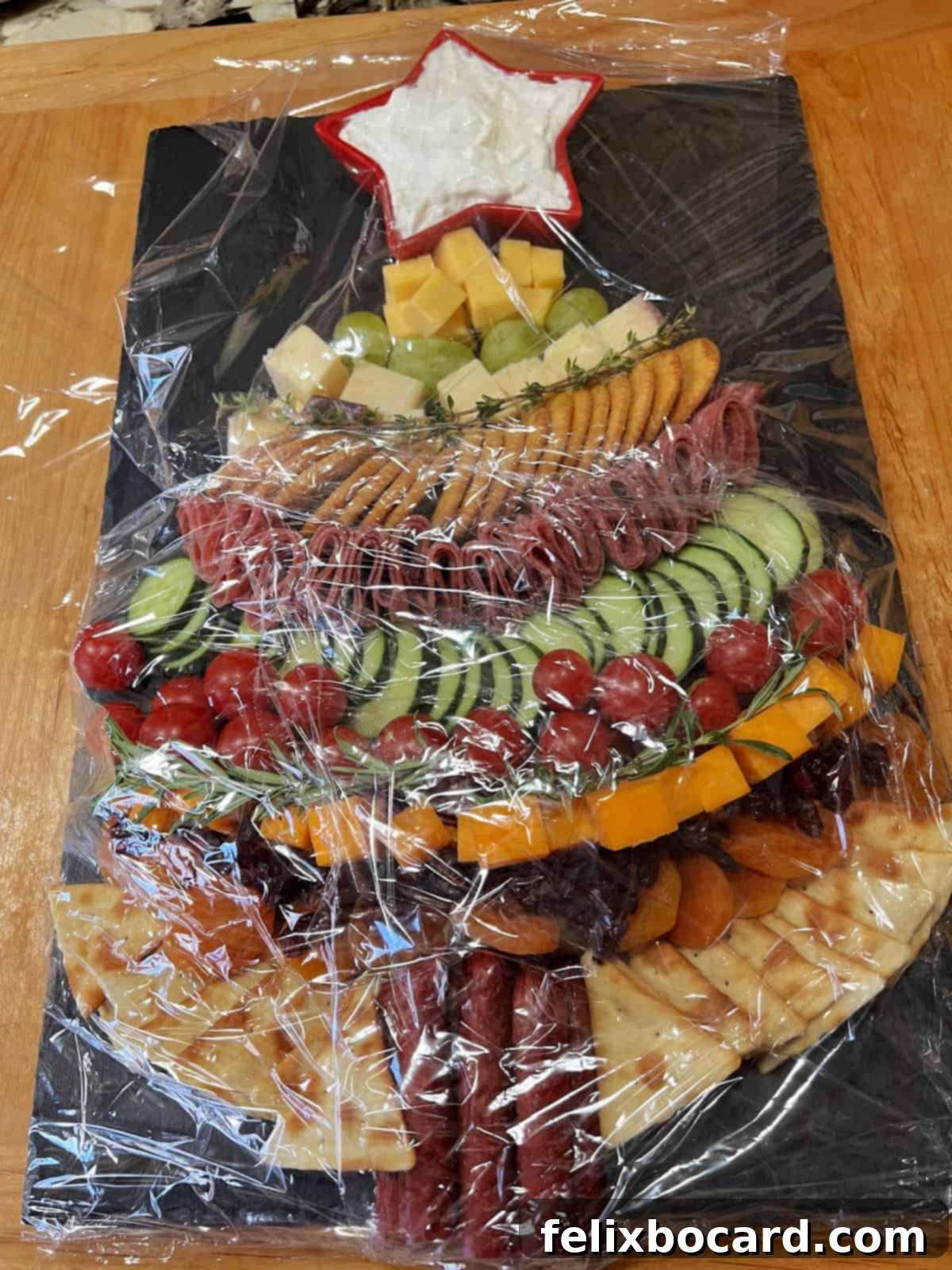 Appetizer board wrapped up for transport.