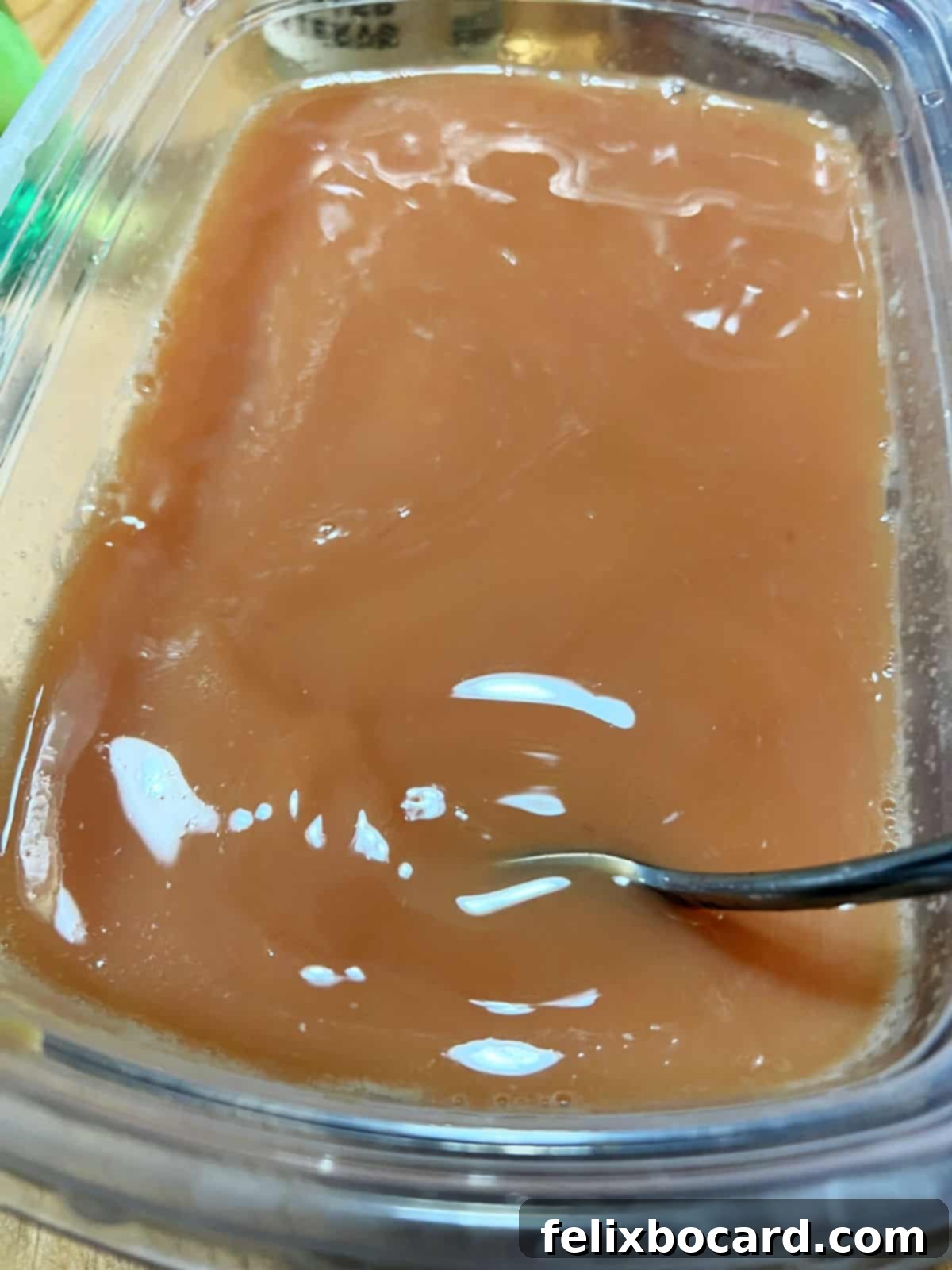 Zesty Cranberry Orange Vodka Chill 4 Mixing the ingredients in a freezer safe container.