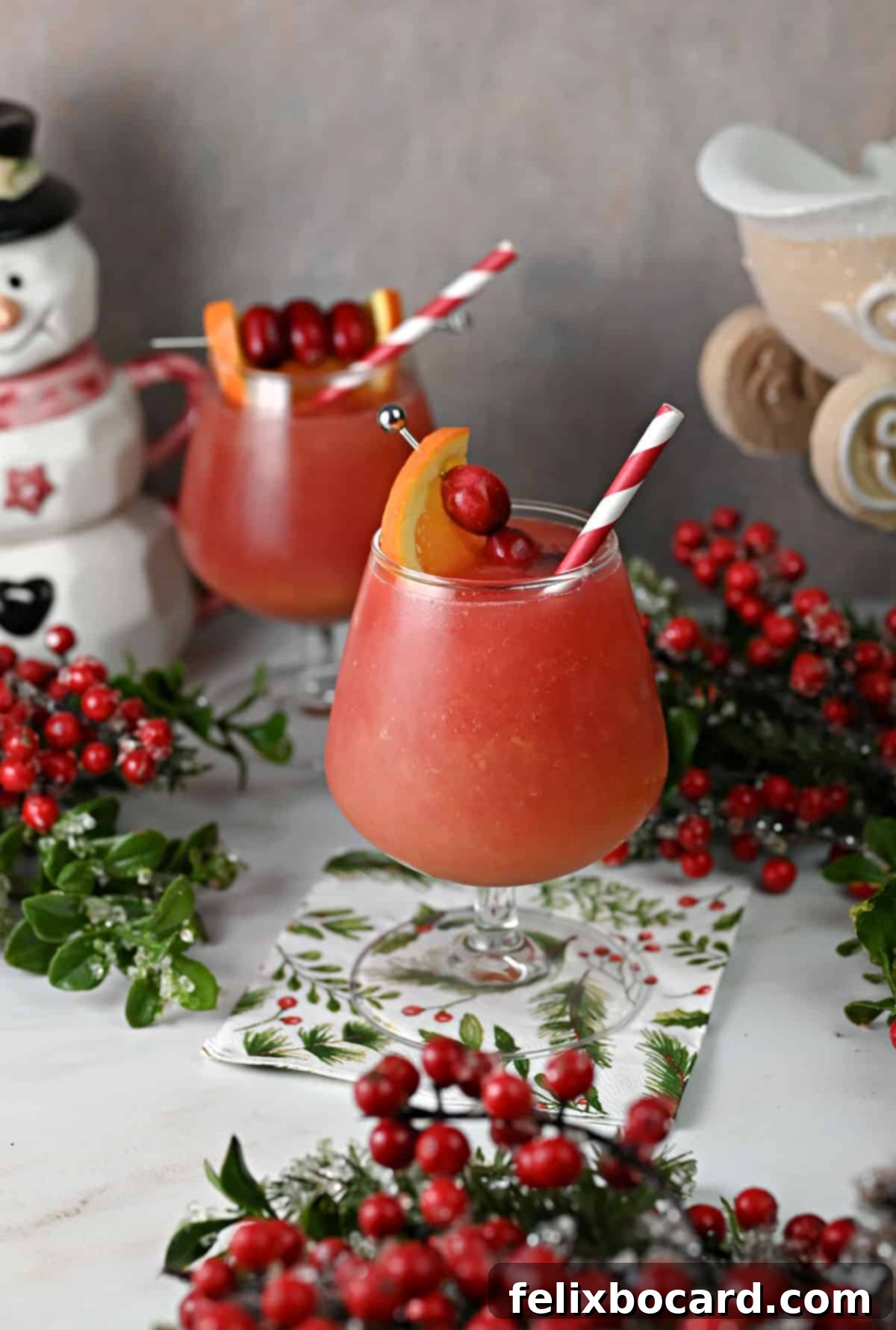 Zesty Cranberry Orange Vodka Chill 8 Cranberry orange vodka slushes in stemmed glasses.
