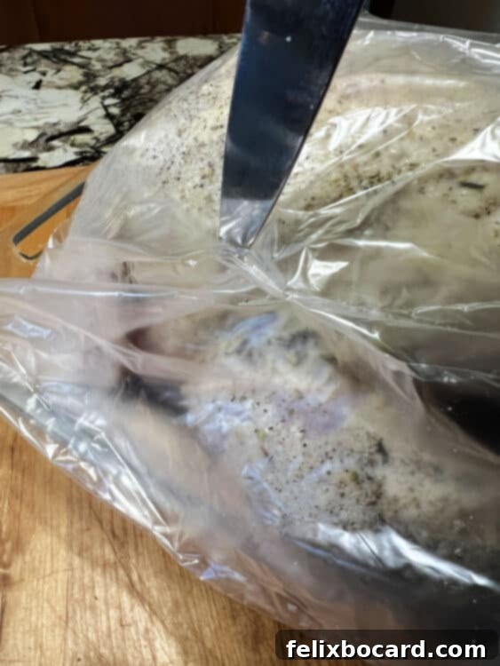 Cutting holes in the bag to allow steam to escape.