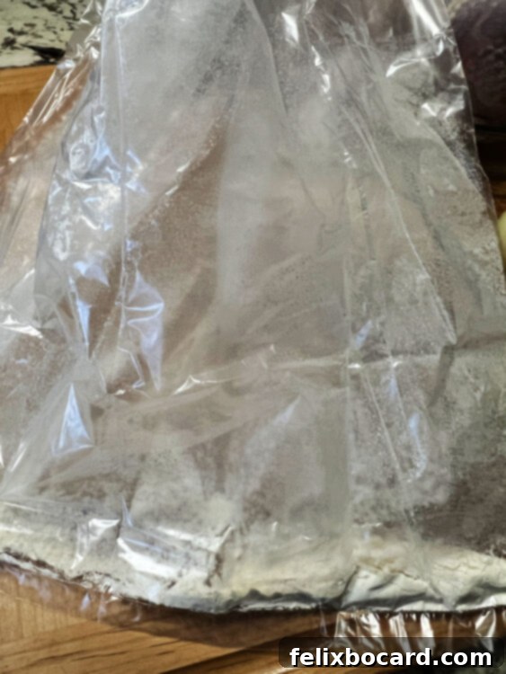 Flour disbursed within the bag after shaking.