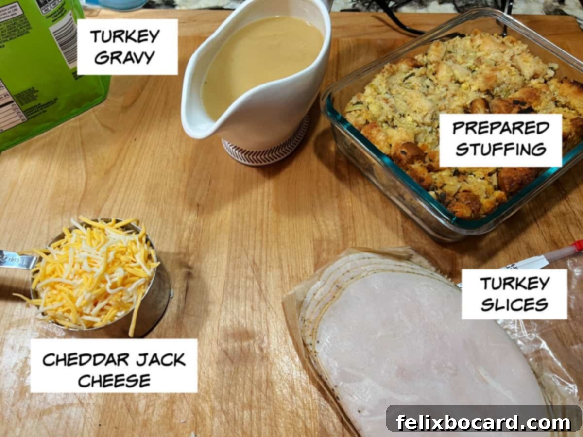 Ingredients for turkey roll-ups: a bowl of rich turkey gravy, a mound of prepared savory stuffing, a stack of thinly sliced turkey, and a bowl of shredded Cheddar Jack cheese, ready for assembly.