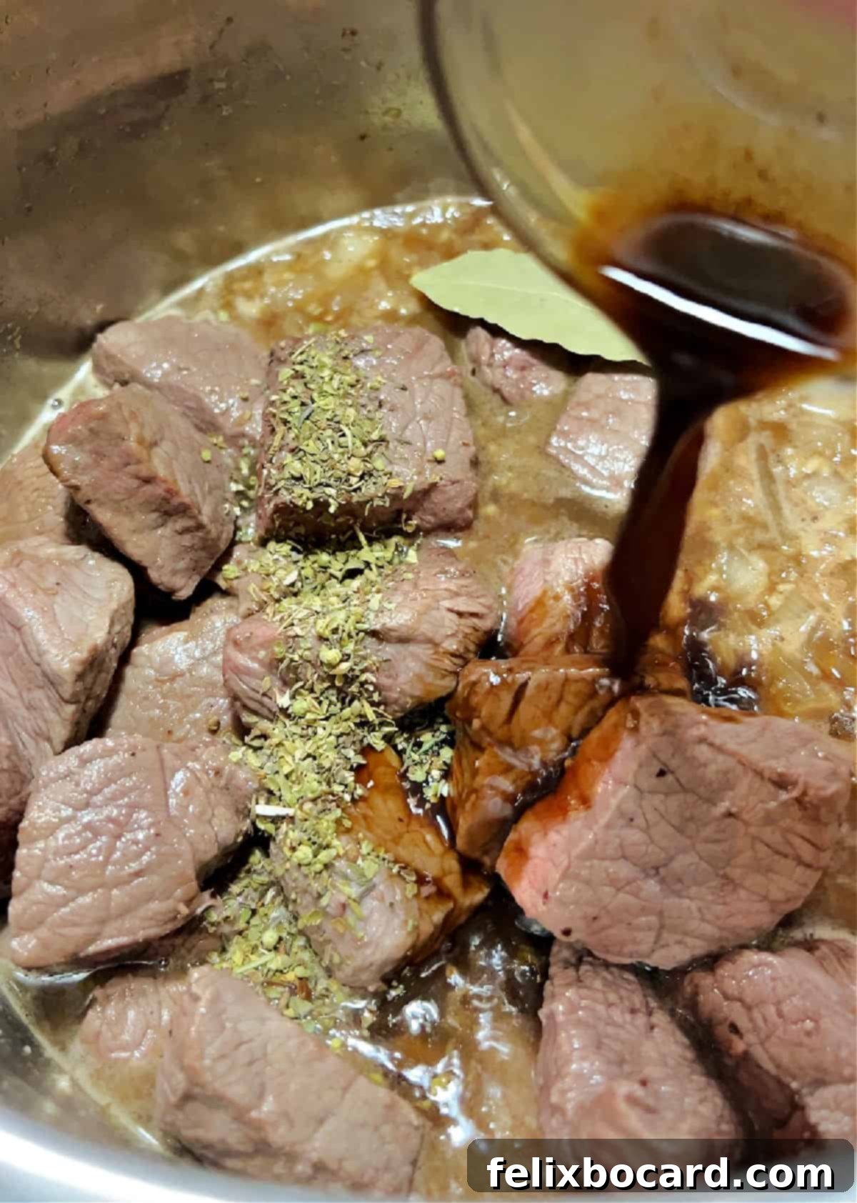 Seasonings including Worcestershire sauce, bay leaf, Italian seasoning, and thyme being added to the Instant Pot with beef and broth.