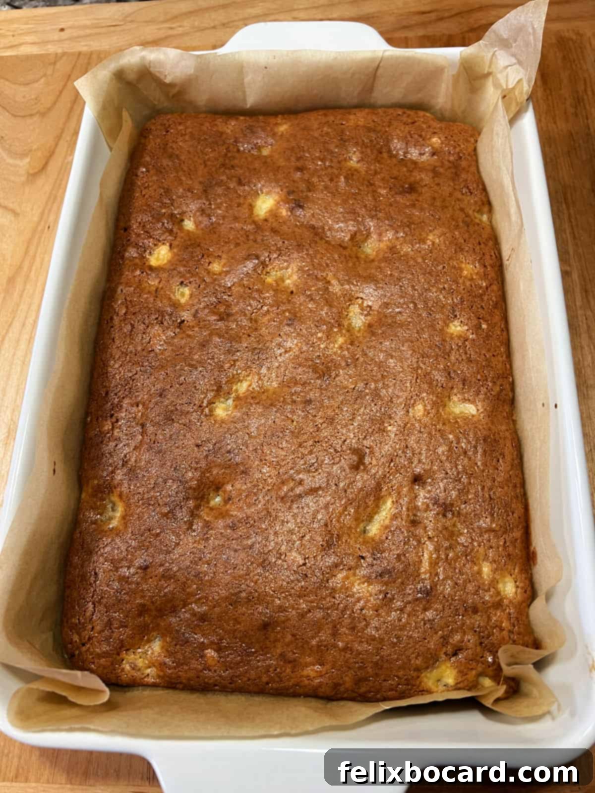 9x13 pan of banana bread ready to be cut.