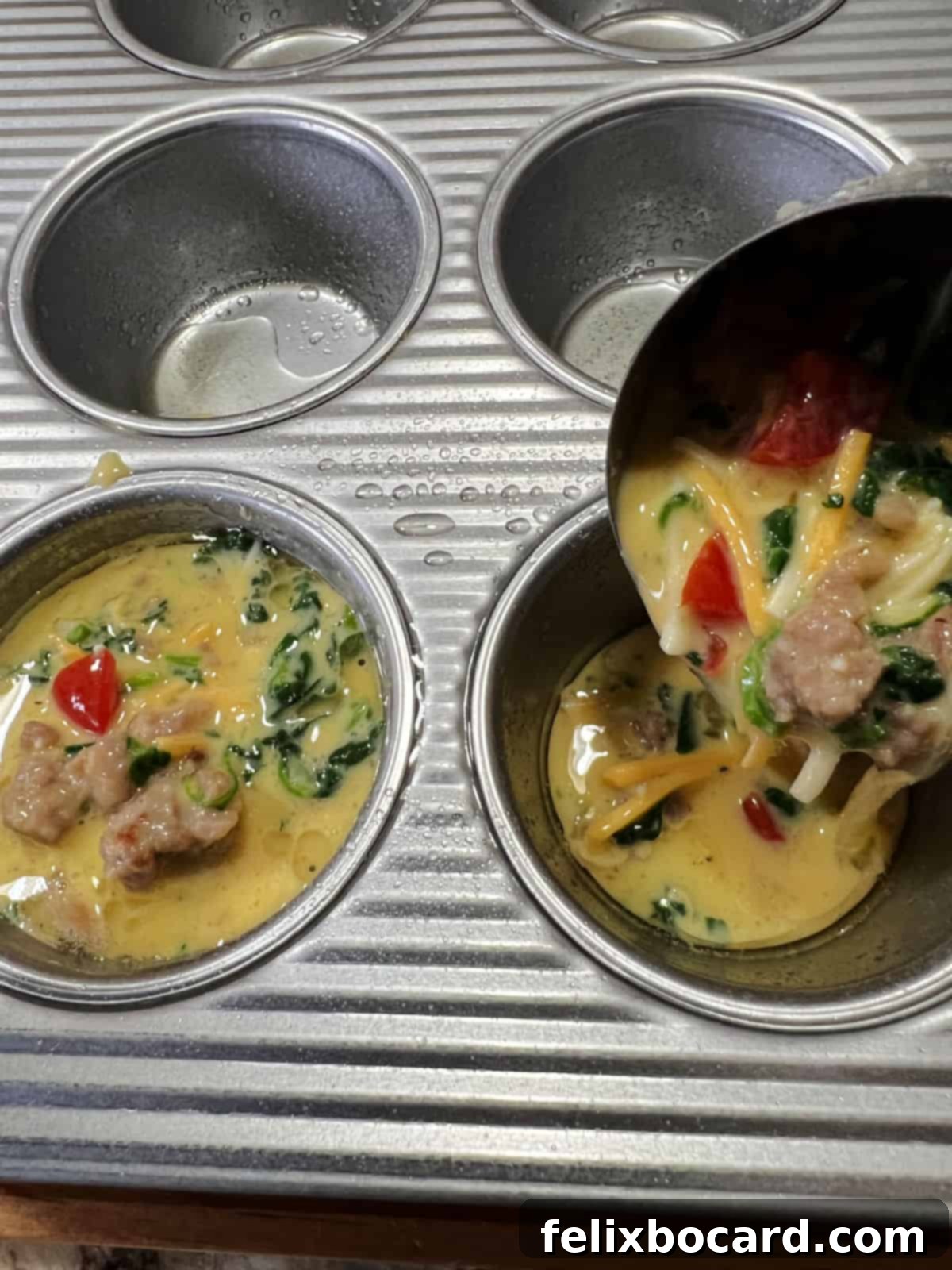 Savory Sausage and Egg Cups 8 Close-up of egg mixture being scooped into a greased muffin tin.