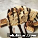 Decadent No-Bake Snickers Treat 7 no bake snickers pie on a white plate