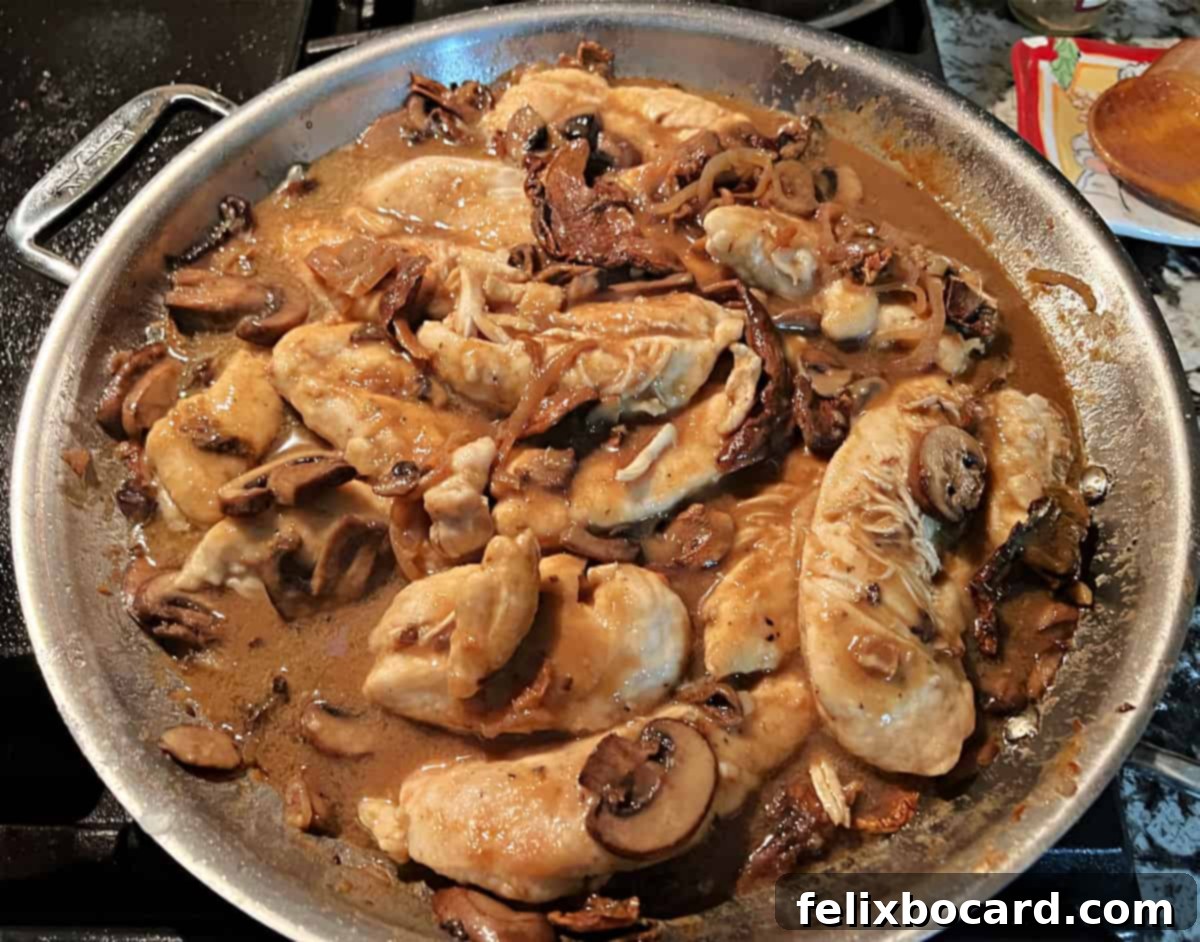Chicken and mushroom Marsala sauce warming in the skillet, ready to be served.