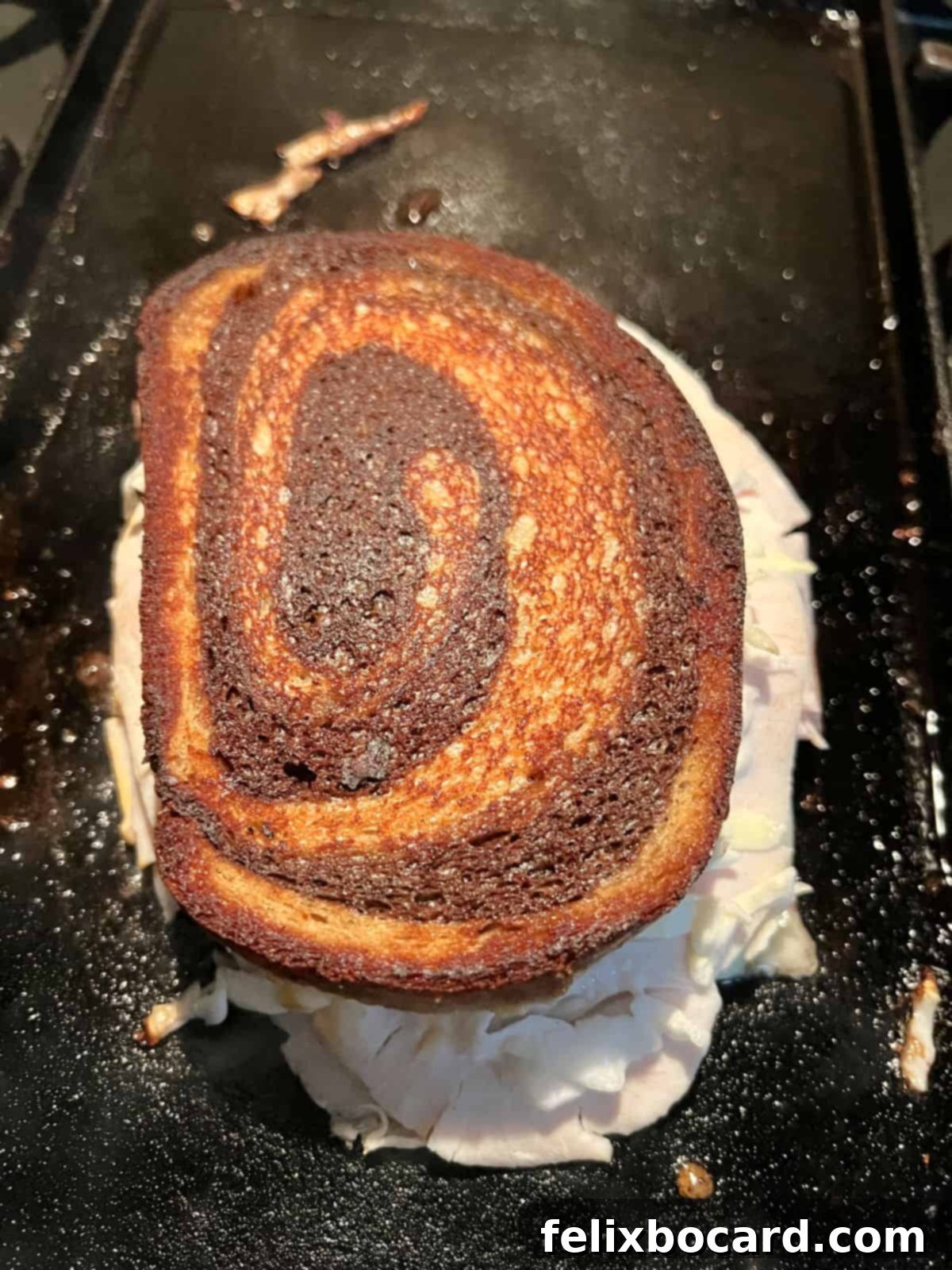 Golden Grilled Turkey Reuben 12 Flipped grilled turkey Reuben (Rachel sandwich) showing toasted side.