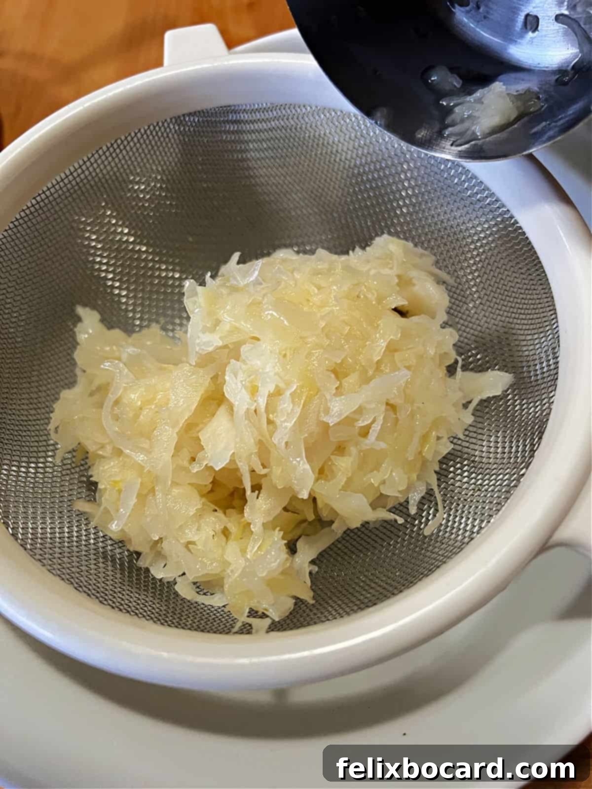 Golden Grilled Turkey Reuben 6 sauerkraut draining to get rid of excess liquid.