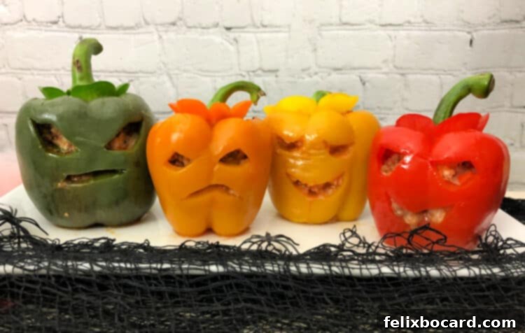 Jack-o'-Lantern Stuffed Bell Peppers 5 Four charmingly carved Jack O' Lantern stuffed peppers, neatly arranged in a row, with their spooky faces greeting you.