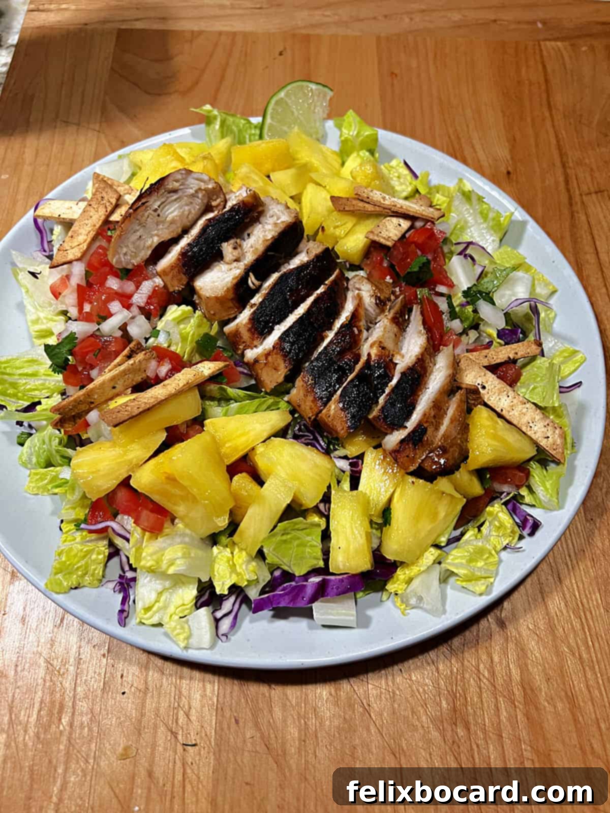 Sliced grilled chicken breast added to the Caribbean salad.