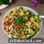 A large serving bowl generously filled with vibrant Mediterranean chopped salad, showcasing a colorful mix of fresh ingredients.