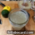 Mason jar full of homemade sweet and sour mix.