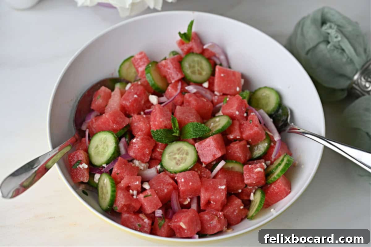 Watermelon feta salad garnished with mint leaves and ready to serve.