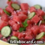 Close up of watermelon feta salad with honey lime dressing.