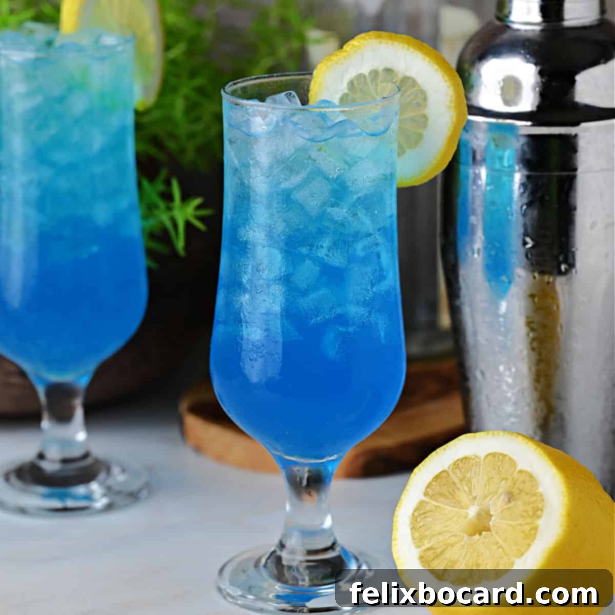 A glass of electric lemonade garnished with a lemon slice, ready to be enjoyed.