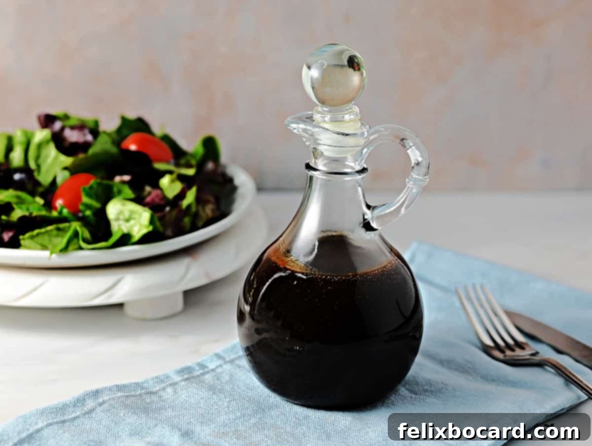 A cruet of homemade balsamic vinaigrette dressing, ready for use.