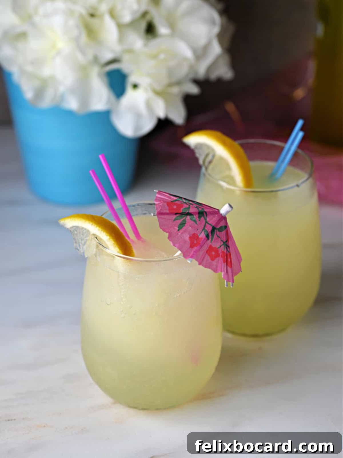 Close-up shot of the icy, refreshing texture of Limoncello vodka lemonade slush, ready to be scooped from its container, promising a cool and zesty summer drink.