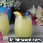 Lemonade Slush made with Limoncello and Vodka. A vibrant, icy blend in a glass, ready for a refreshing sip.