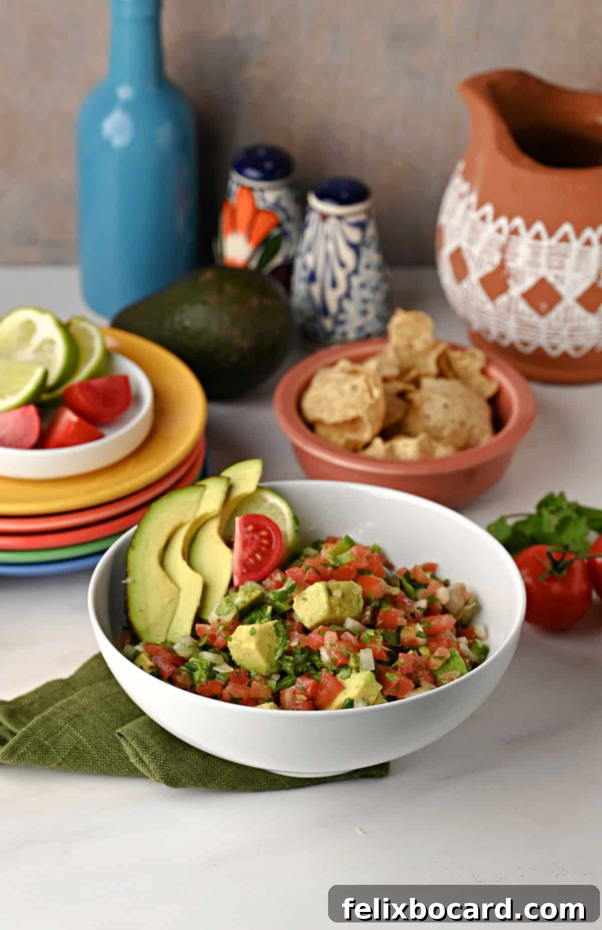 Avocado Pico de Gallo 10 A bowl of vibrant Pico Avocado dip, perfectly mixed and ready to eat, served with a spoon.