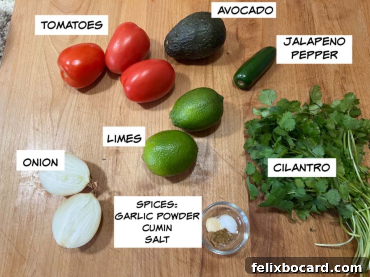 Avocado Pico de Gallo 3 Fresh ingredients laid out: Roma tomatoes, ripe avocado, a vibrant green jalapeƱo pepper, fresh cilantro, white onion, and a few limes.