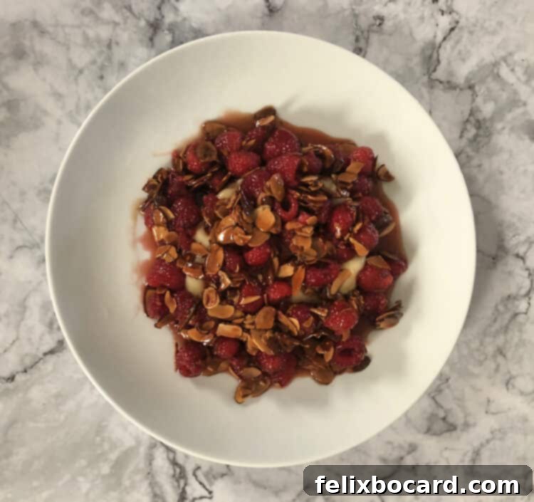 Warm baked Brie with raspberry and almond topping